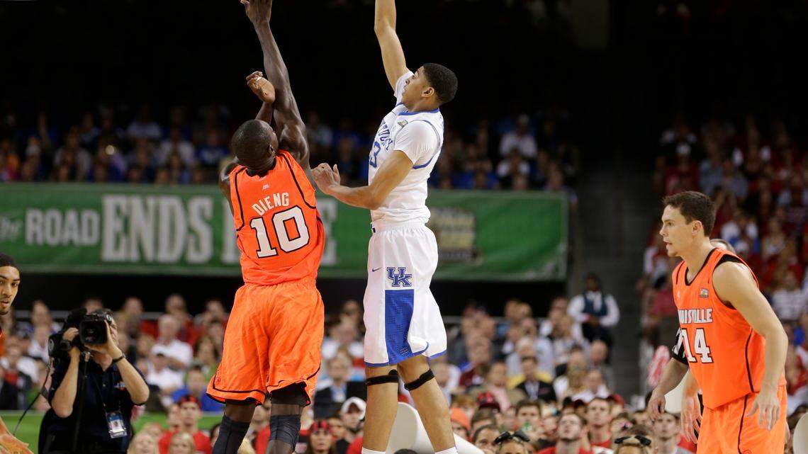 Gorgui Dieng (10) of the Louisville Cardinals tried to defend Anthony Davis (23) of the Kentucky Wildcats in the semifinal game of the NCAA Final Four basketball tournament Saturday, March 31, 2012, in New Orleans. Photo by Mark Cornelison | Staff

