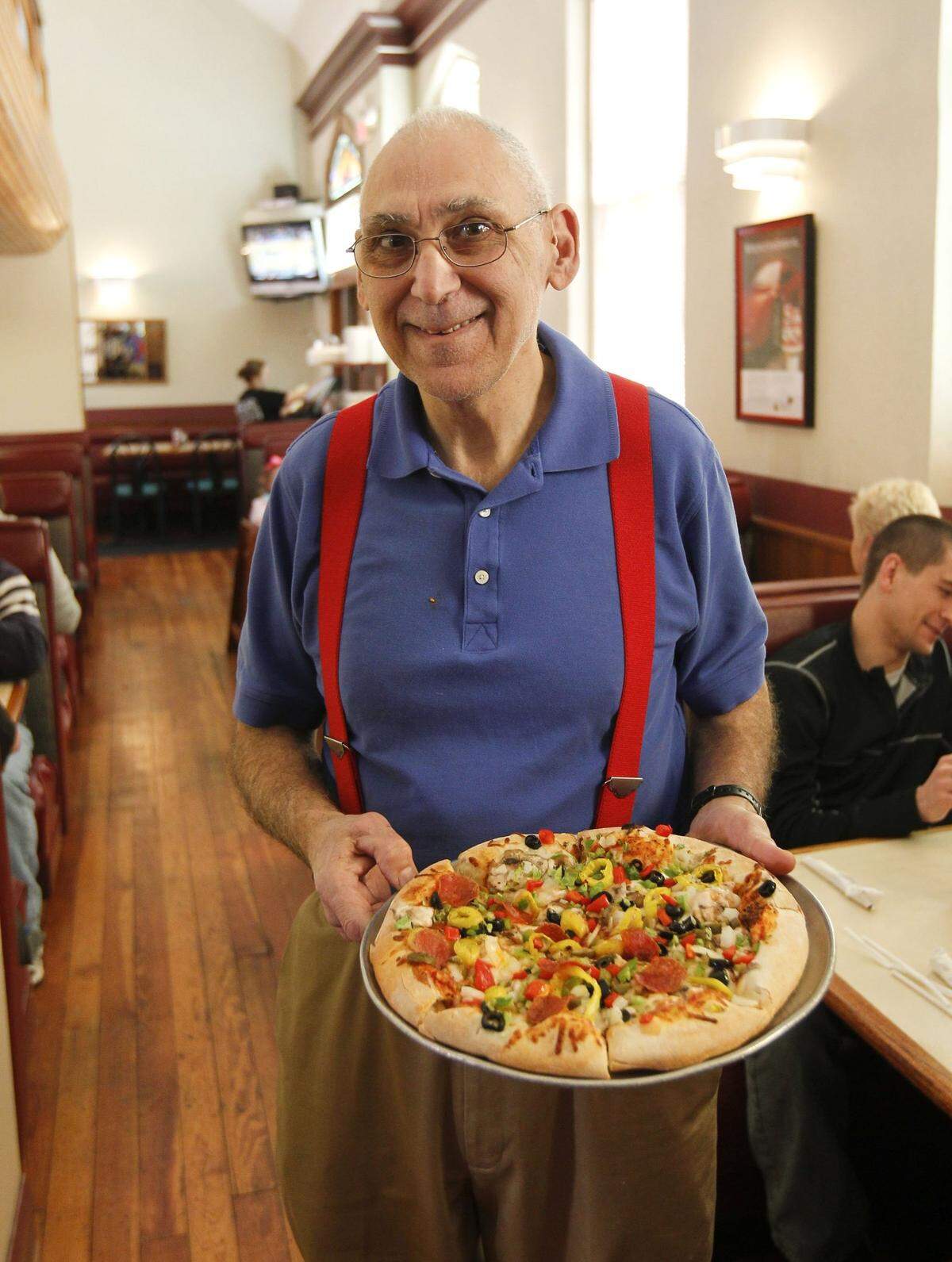 Joe Bologna with a pizza he made at his Joe Bologna’s restaurant, 120 West Maxwell St. in Lexington., Ky.,Wednesday, March 13, 2013. Joe Bologna’s restaurant is 40 years old. Photo by Charles Bertram | Staff
