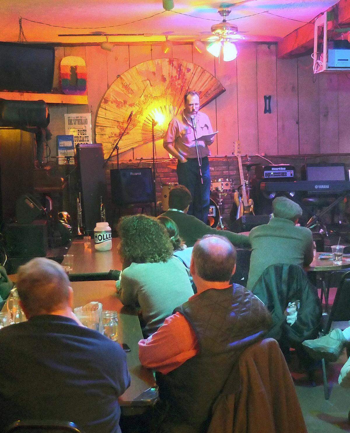 Poet Maurice Manning reads during Holler Poet’s 60th monthly session in March 2013 at Al’s Bar. The new owners plan to continue having live entertainment.