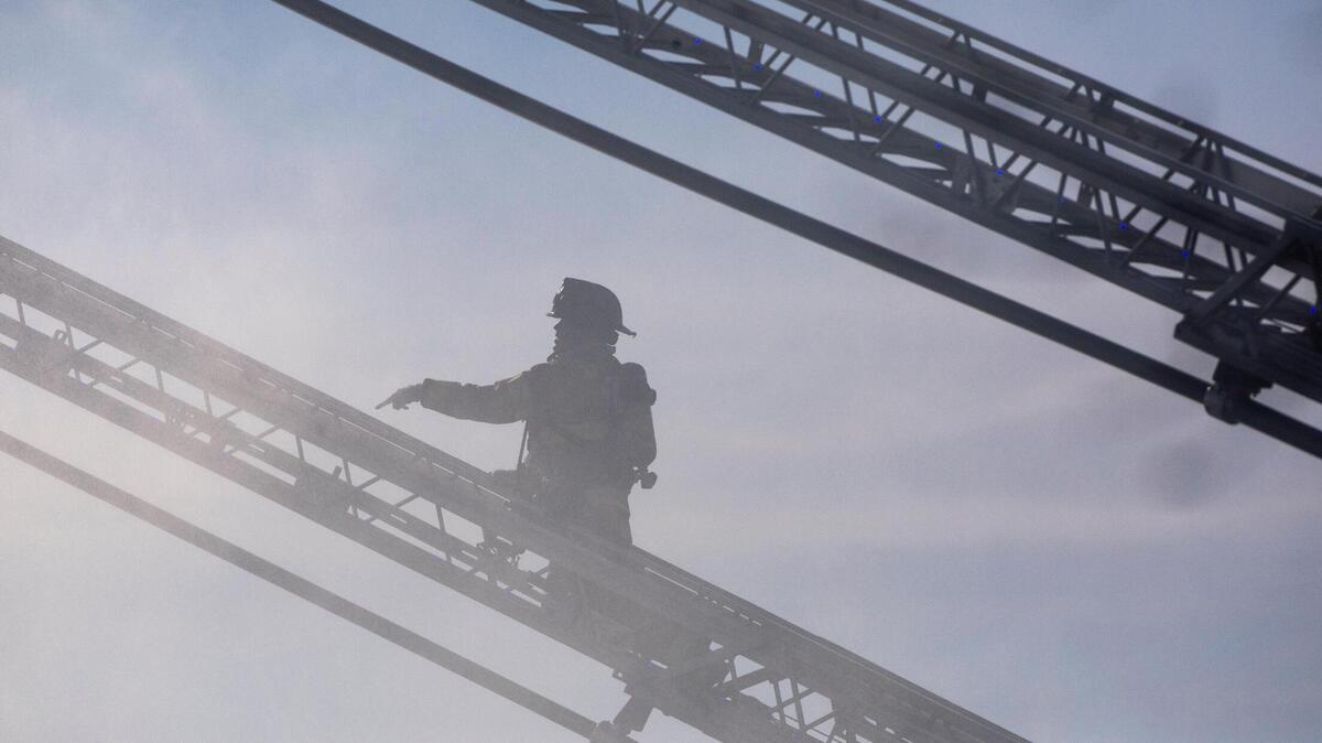 Firefighters worked at the scene of a structure fire in Lexington, Ky., Dec. 11, 2020.