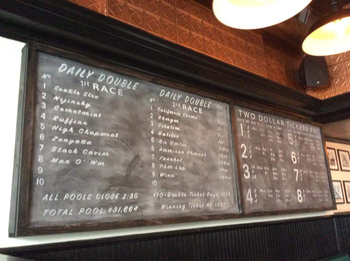 The Horse and Jockey, a new Irish-themed gastropub in downtown Lexington, has equine touches, including a chalk “tote board” with two star-studded races.