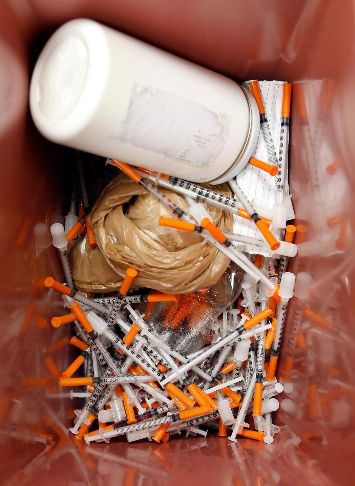 A can full of discarded needles at the Lexington-Fayette County Health Department in Lexington, Ky., Tuesday, September 13, 2016.