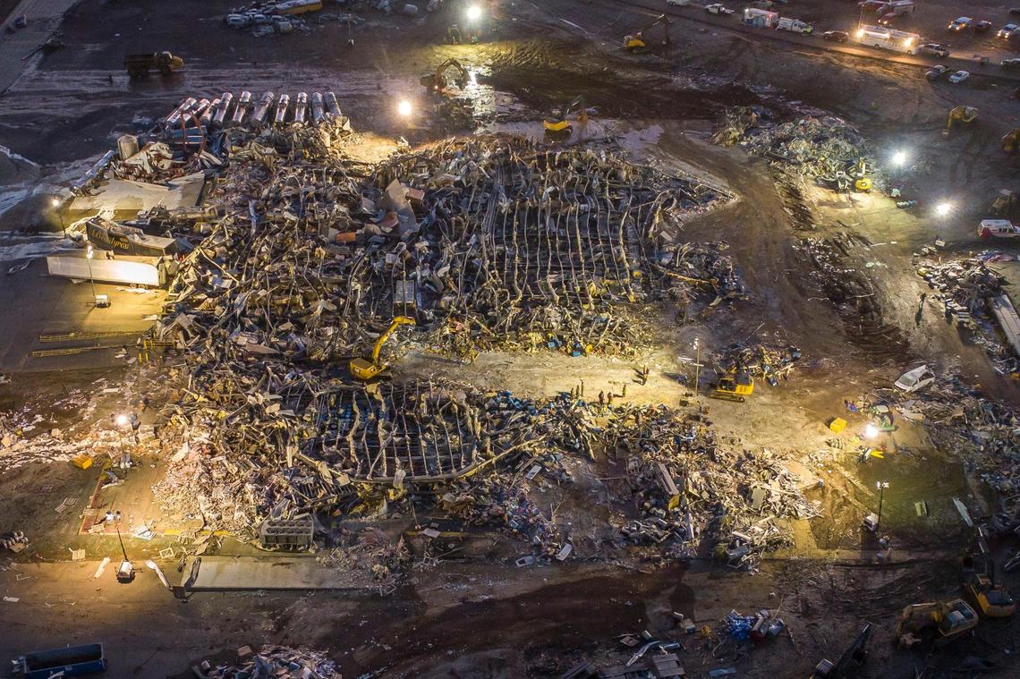 Search are rescue crews work at the Mayfield Consumer Products candle factory early Sunday, Dec. 12, 2021. A tornado traveled through the region Friday night.