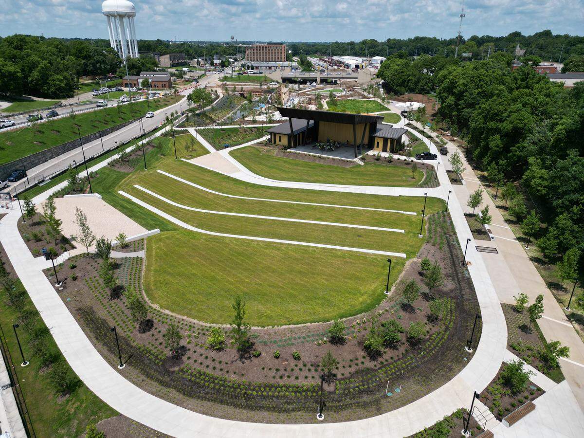 Seating areas on the lawn around the new outdoor amphitheater opening in Gatton Park
