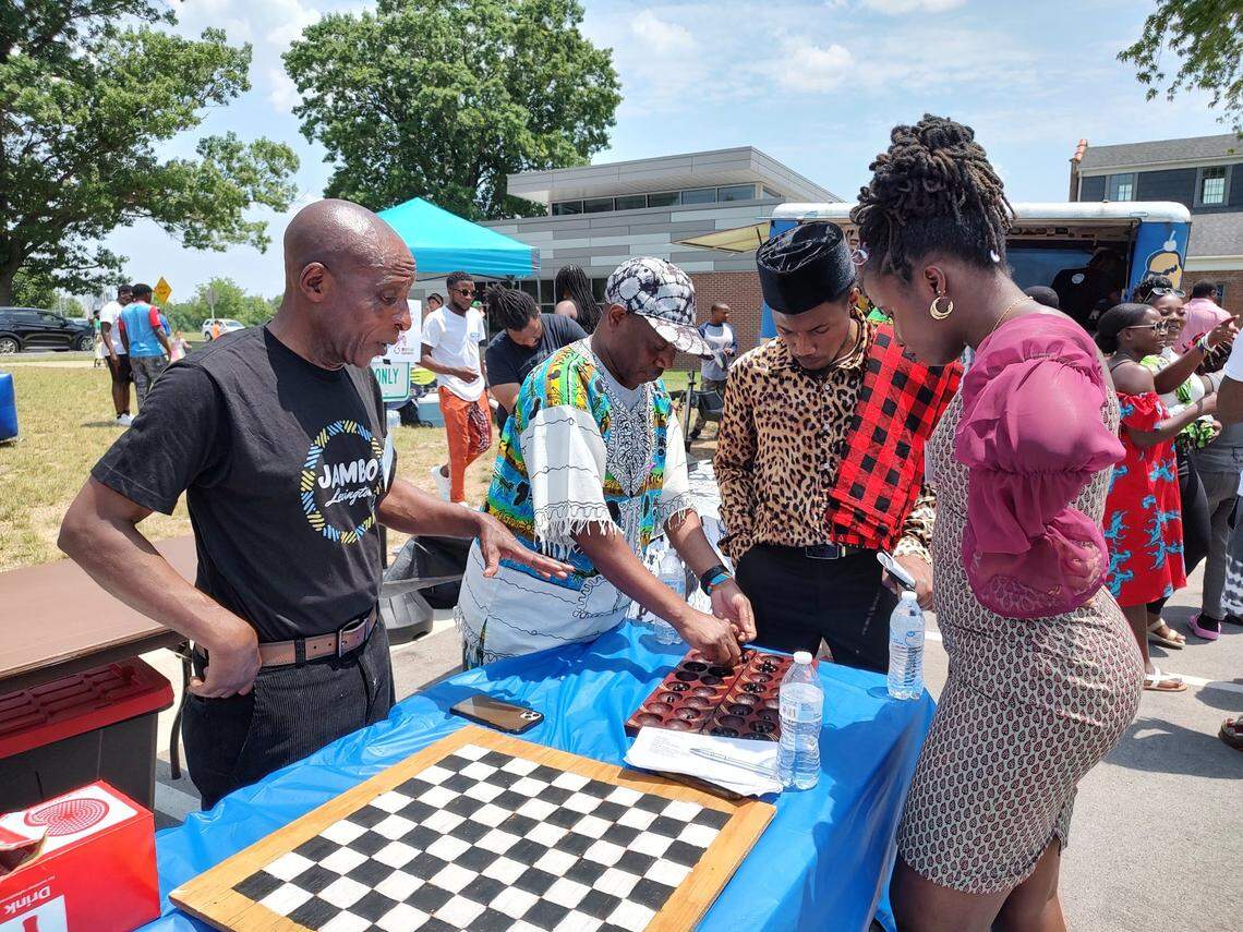 Attendees played an African board game at Swahili Day in Lexington, Ky., on June 3, 2023.