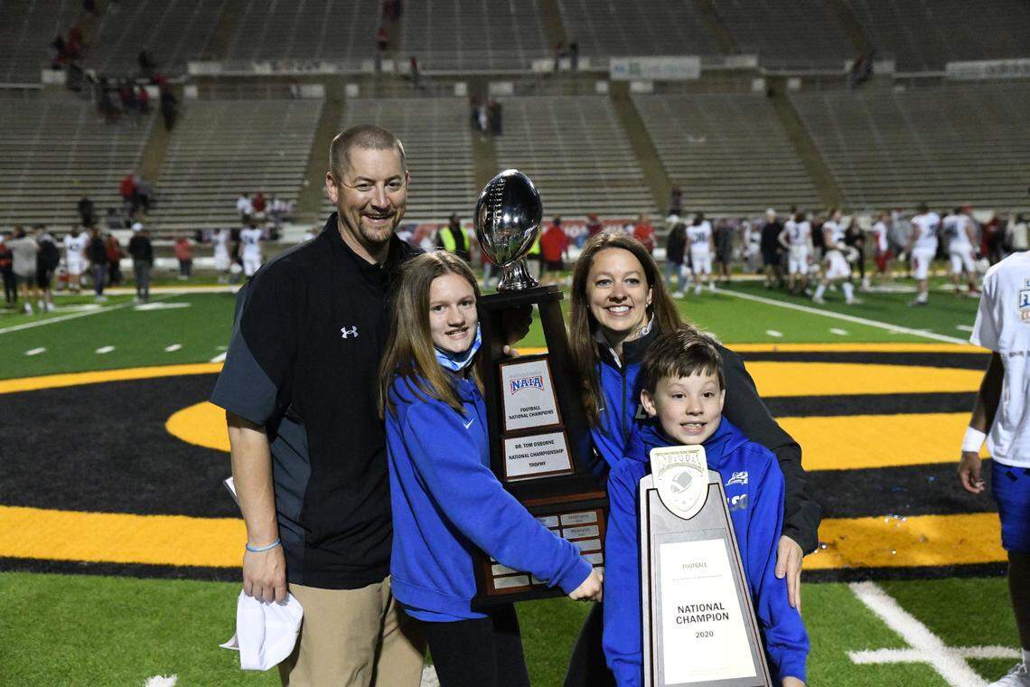 Lindsey Wilson College football coach Chris Oliver celebrated the Blue Raiders’ 45-13 NAIA national championship game victory against Northwestern College with his family, wife Wendy; daughter Samantha; and son Patrick.