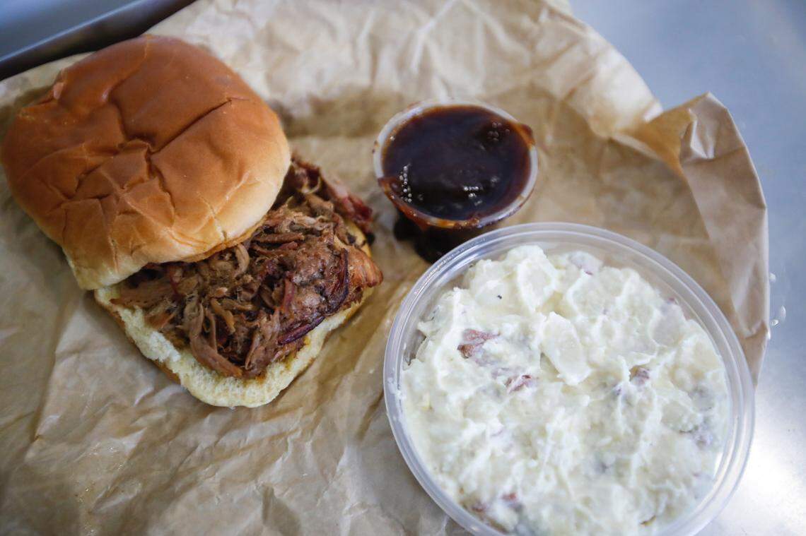 A pulled pork sandwich, potato salad and sauce from City Barbeque, one of three new concession stands at Kroger Field for the 2022 football season.