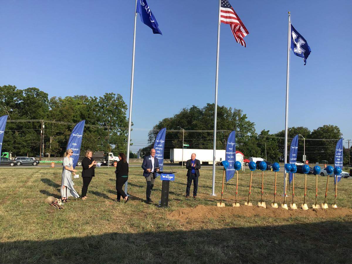 University of Kentucky football coach Mark Stoops, center joined Kroger Co. Louisville division president Jake Cannon, at podium, and others to break ground for the new Kroger Marketplace coming to Newtown Pike.