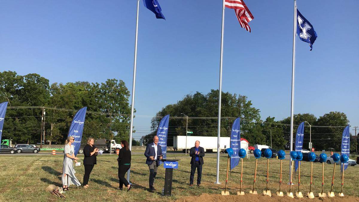 University of Kentucky football coach Mark Stoops, center joined Kroger Co. Louisville division president Jake Cannon, at podium, and others to break ground for the new Kroger Marketplace coming to Newtown Pike.