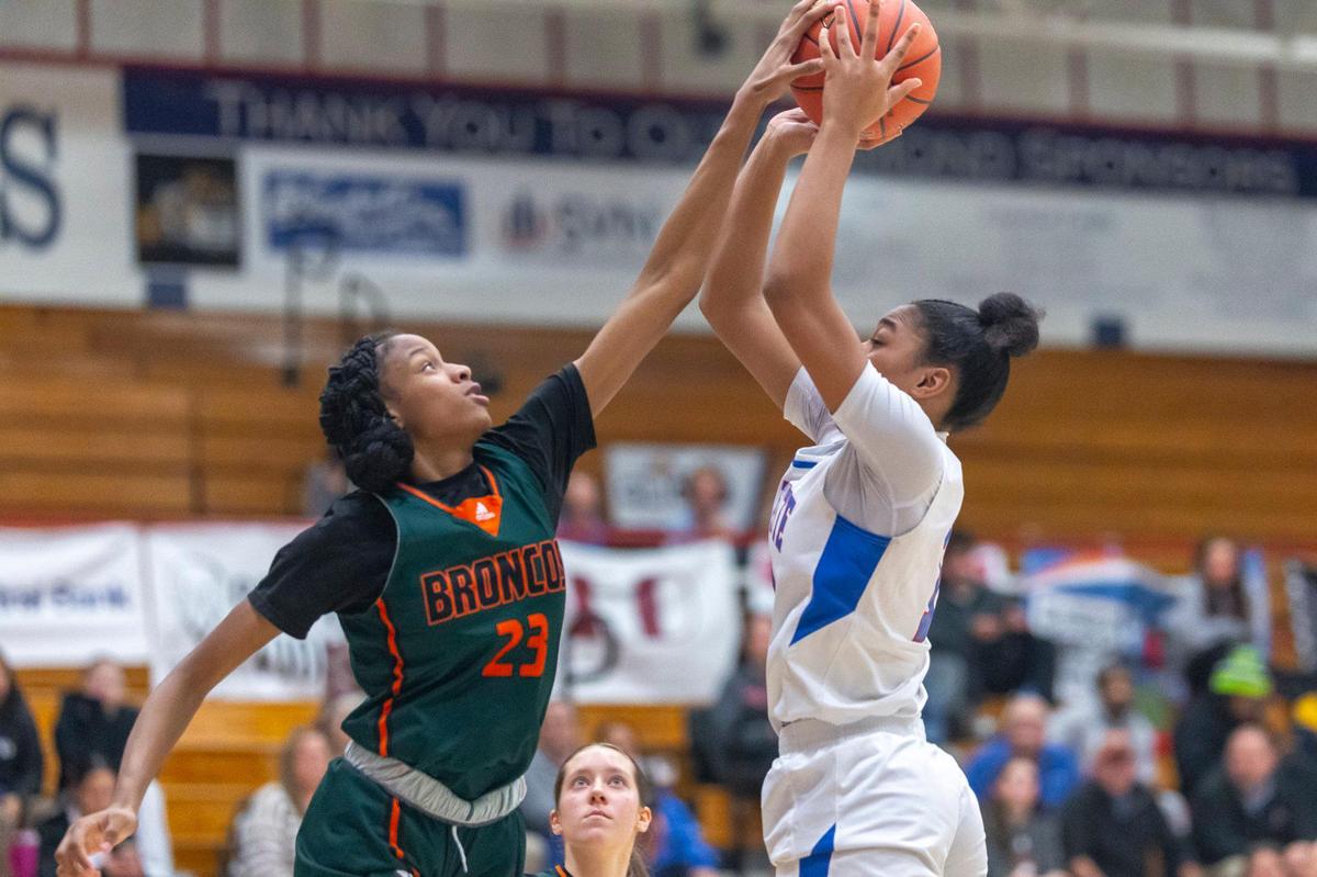 Frederick Douglass’ Jaelee Knowles (23) blocks the shot of Lafayette’s Belle Combs (11) at Lafayette on Jan. 22. Knowles and Combs were voted the top two players in Lexington this season by the city’s coaches.