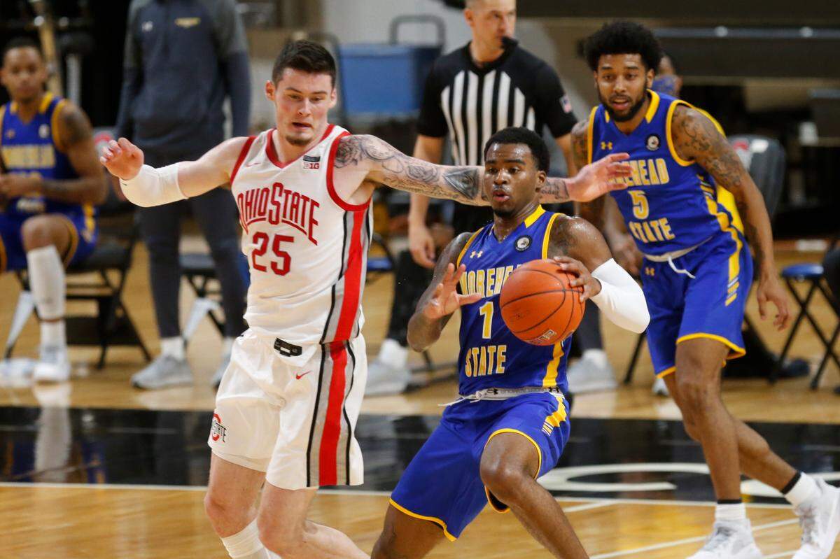 Morehead State guard DeVon Cooper, right, had 25 points, six rebounds and four assists in the Eagles’ victory over Eastern Kentucky in the OVC Tournament semifinals.