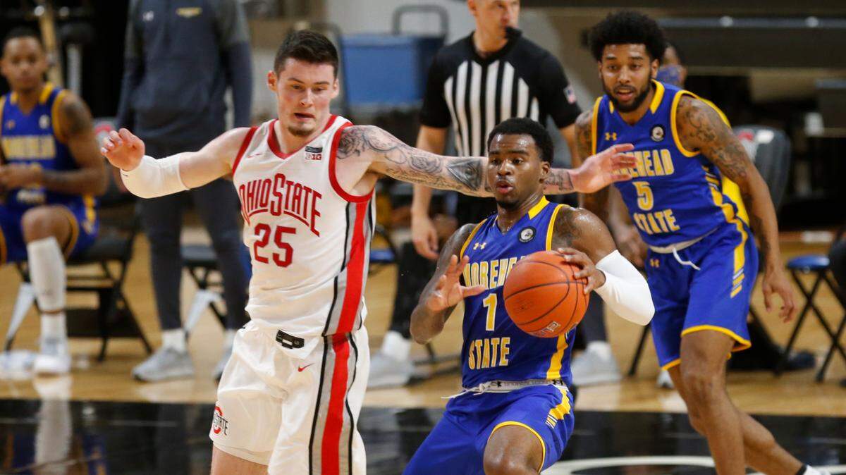 Among former Kentucky prep stars, Morehead State guard DeVon Cooper, right, is the leading scorer in the NCAA Tournament at 12.2 points per game.
