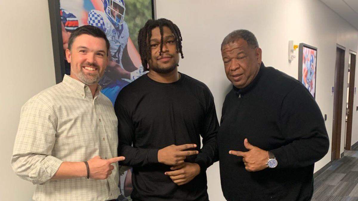Darrion Henry-Young, center, with Brad White and Vince Marrow.