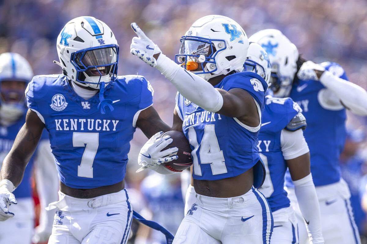 Kentucky defensive back Ty Bryant (14) celebrates after making an interception against Ole Miss at Kroger Field on Saturday.