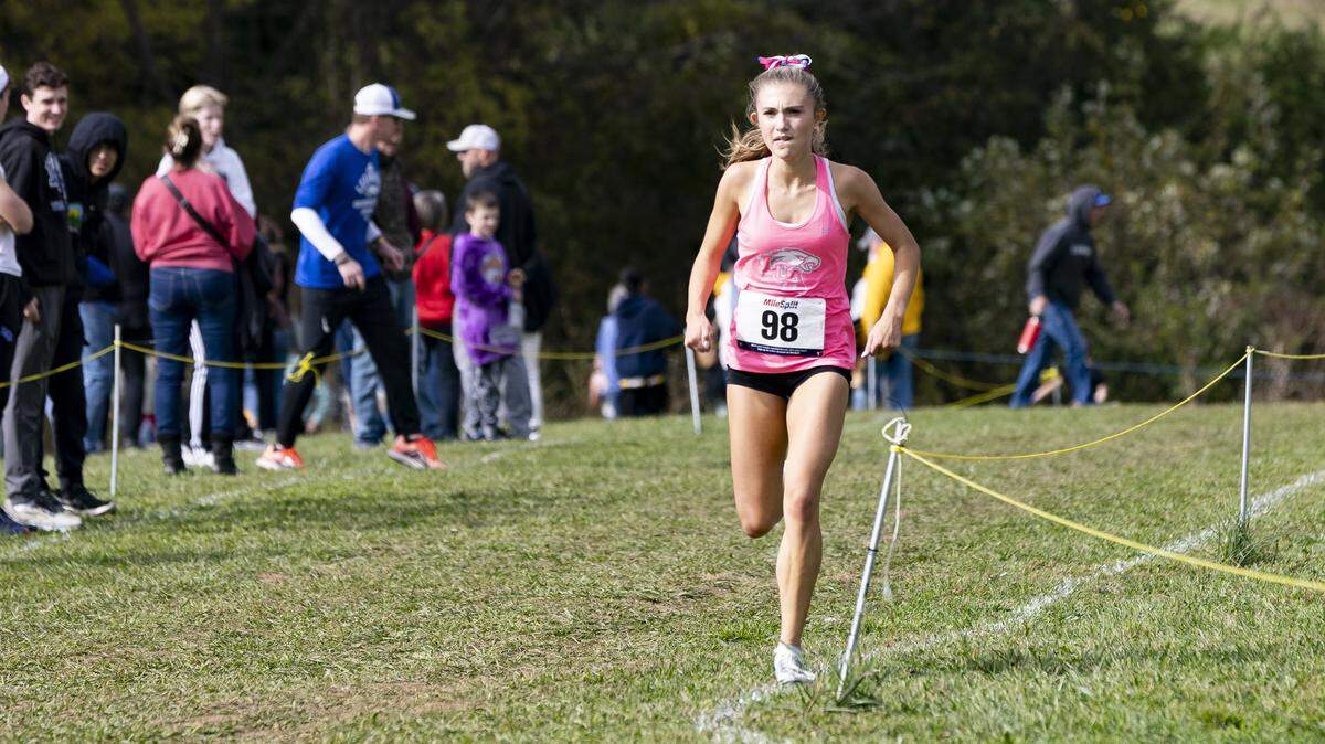 Lexington Christian’s Kennedy Moughamian eyes the finish line for her third straight first-place finish in the girls Class A, 5th Region Cross Country Championships at Shelby County Cross Country Course in Shelbyville on Saturday.