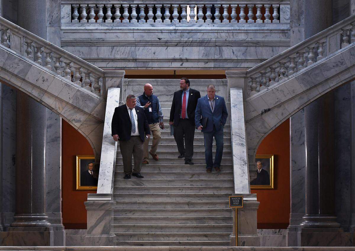 Rep. Chris Fugate, R-Chavies, Rep. Scott Lewis, R-Hartford, Rep. Patrick Flannery, R-Olive Hill, and Rep. Timmy Truett, R-McKee, talk as they make their way down the House stairs in 2024.