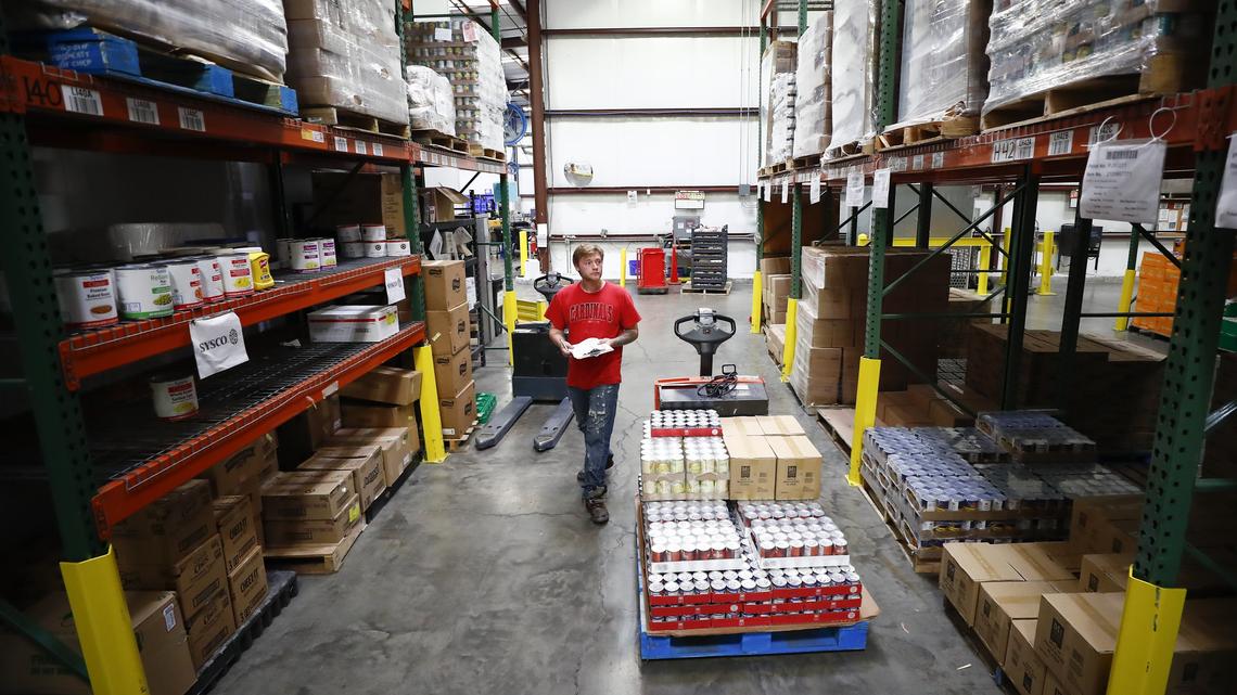 Nick Phillips, of Nicholasville, Ky., loads a pallet of food which will stock the Cambridge Drive location at God’s Pantry Food Bank in Lexington, Ky., Thursday, June 20, 2019.