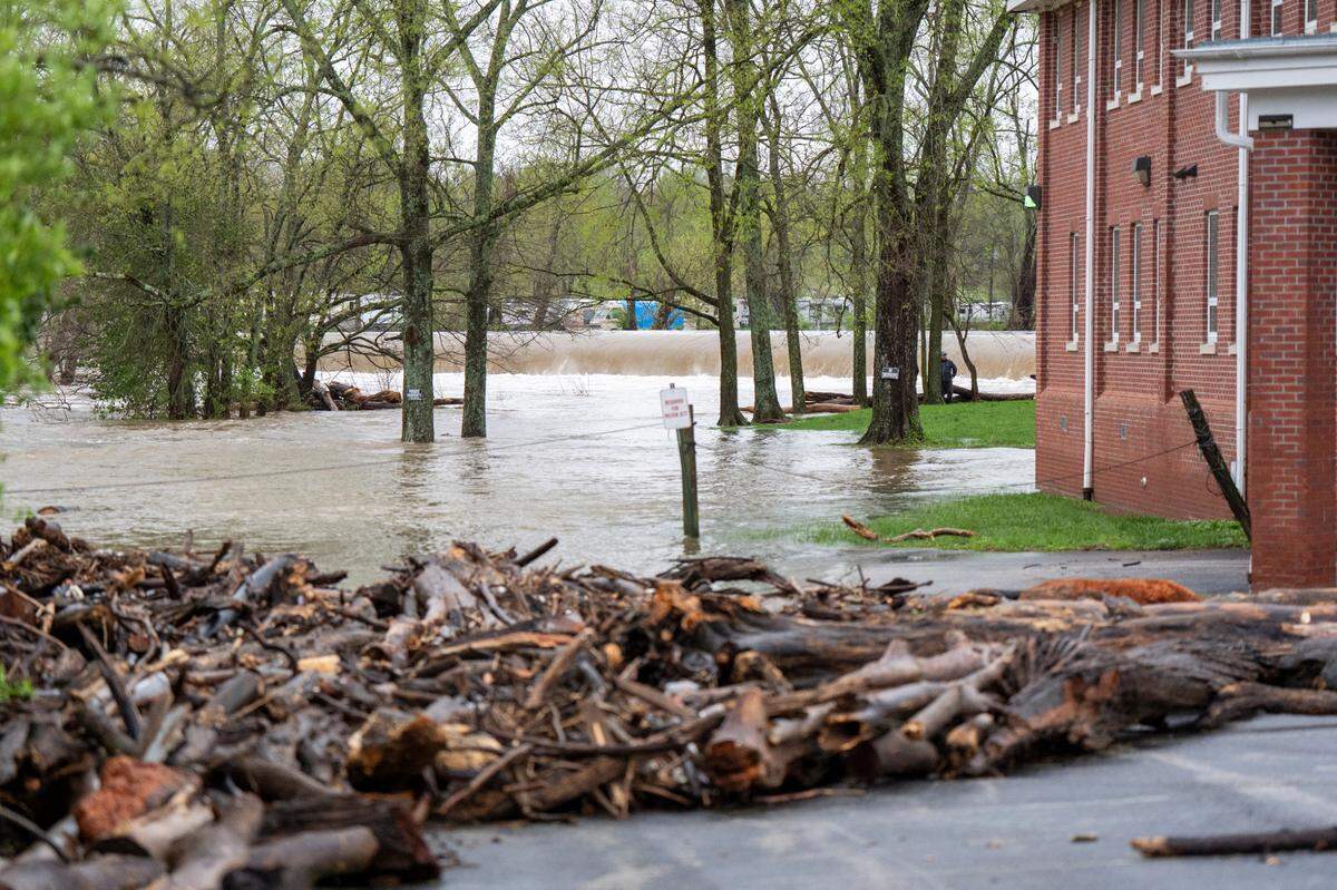 The parking lot of Ambassador’s for Christ Ministries parking lot had debris and flood water near the Forks of the Elkhorn , Sunday April 6, 2025 in Frankfort, Ky. Photo by Mark Mahan