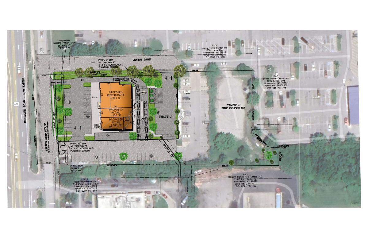 A rendering of the new building, submitted to the city planning division, shows a restaurant and two stores and a wrap-around double lane drive-thru on the property in front of Lowe’s on Richmond Road.