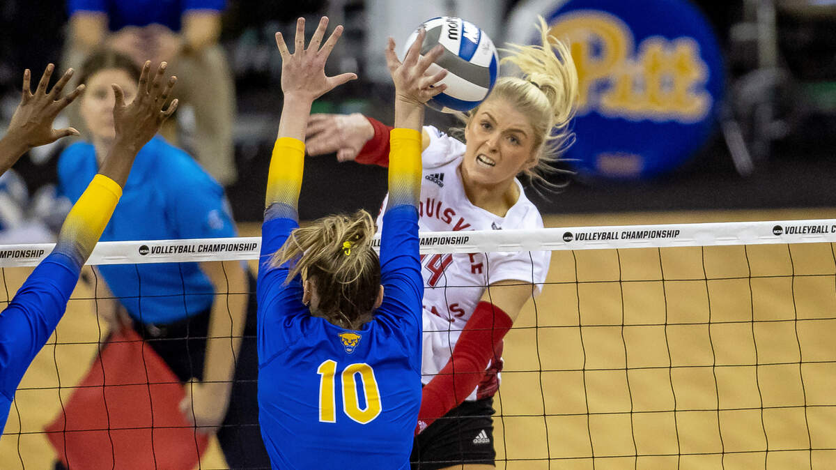 Louisville’s Anna DeBeer (14) spikes the ball against Pittsburgh’s Rachel Fairbanks (10) in the third set during the semifinals of the NCAA volleyball tournament, Thursday, Dec. 15, 2022, in Omaha, Neb. Shoulder injuries can be quite common in elite volleyball players.