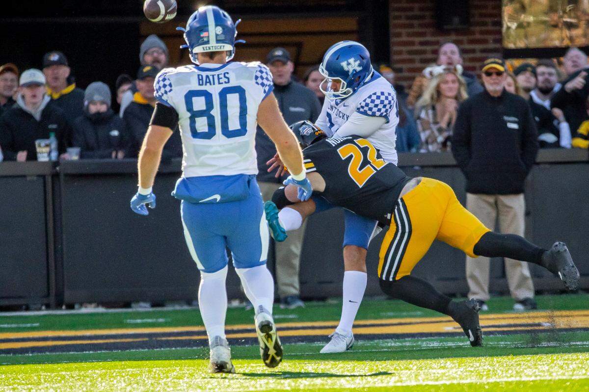 Late in UK’s 21-17 victory over Missouri, Kentucky punter Colin Goodfellow (94) was roughed by Tigers linebacker Will Norris (22), a play that helped the Wildcats preserve their victory.