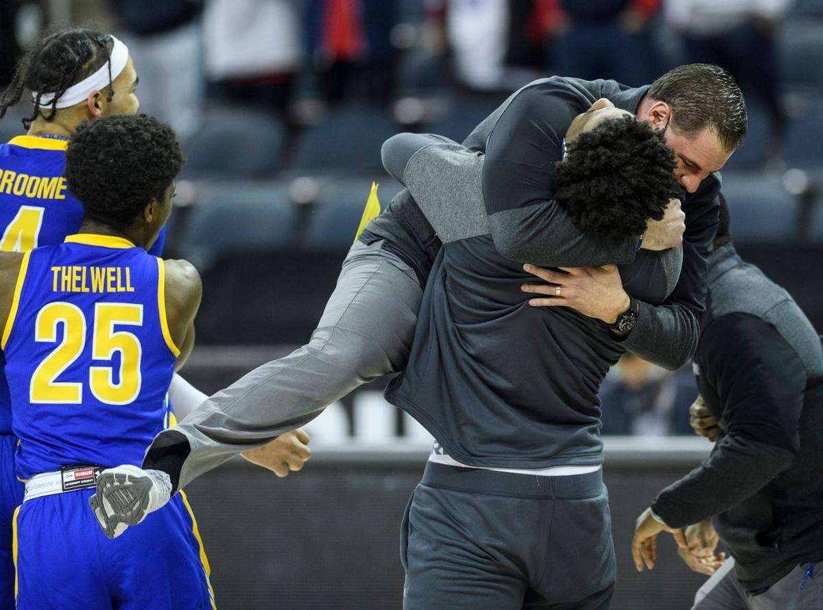 Morehead State Coach Preston Spradlin was hoisted into the air as the Eagles celebrated after beating Belmont to win the 2021 OVC Tournament and earn a berth in the NCAA tourney.
