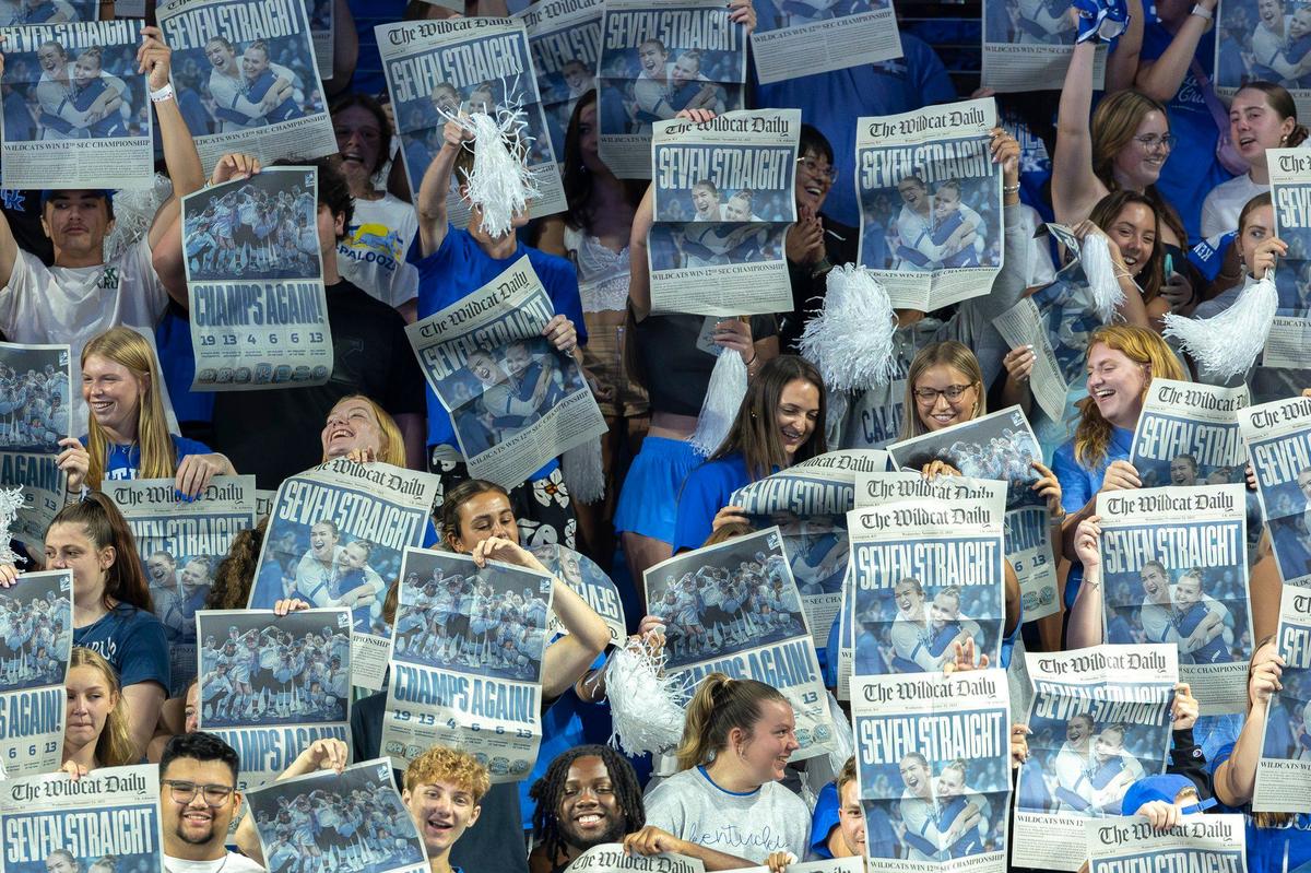 The Kentucky student section holds up newspapers as Northern Kentucky players are introduced before a volleyball match at the newly renovated Memorial Coliseum on Friday.
