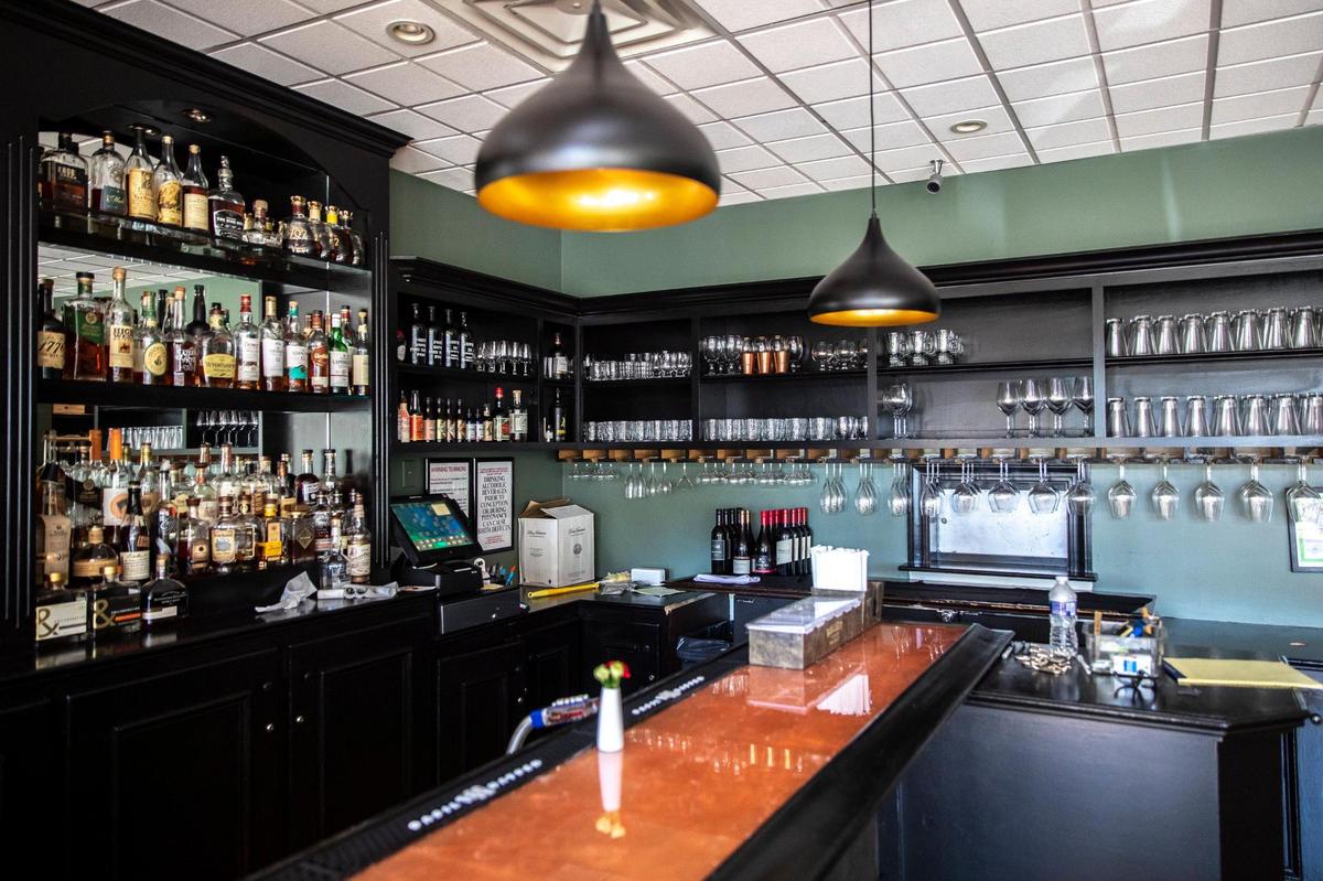 A bar at Distilled features copper leaf, applied by artist Amanda Matthews of Prometheus Art.