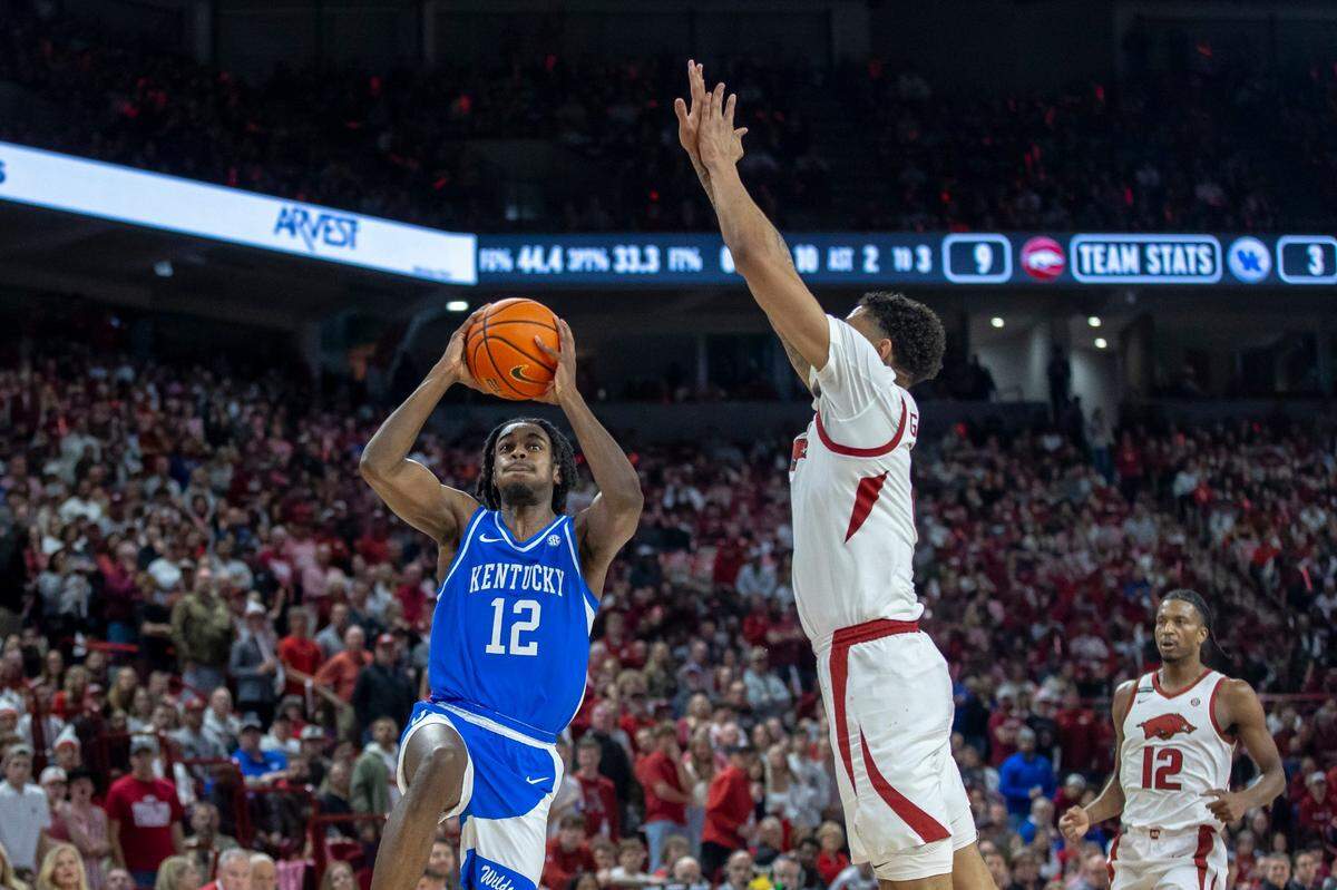 Kentucky guard Antonio Reeves (12) had 24 points, four rebounds and two steals to lead the Wildcats to a 63-57 win at Arkansas on Saturday.