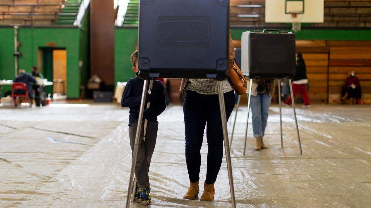 Voters cast their ballots at the Dunbar Community Center polling location in Lexington, Ky., Tuesday, November 3, 2020.