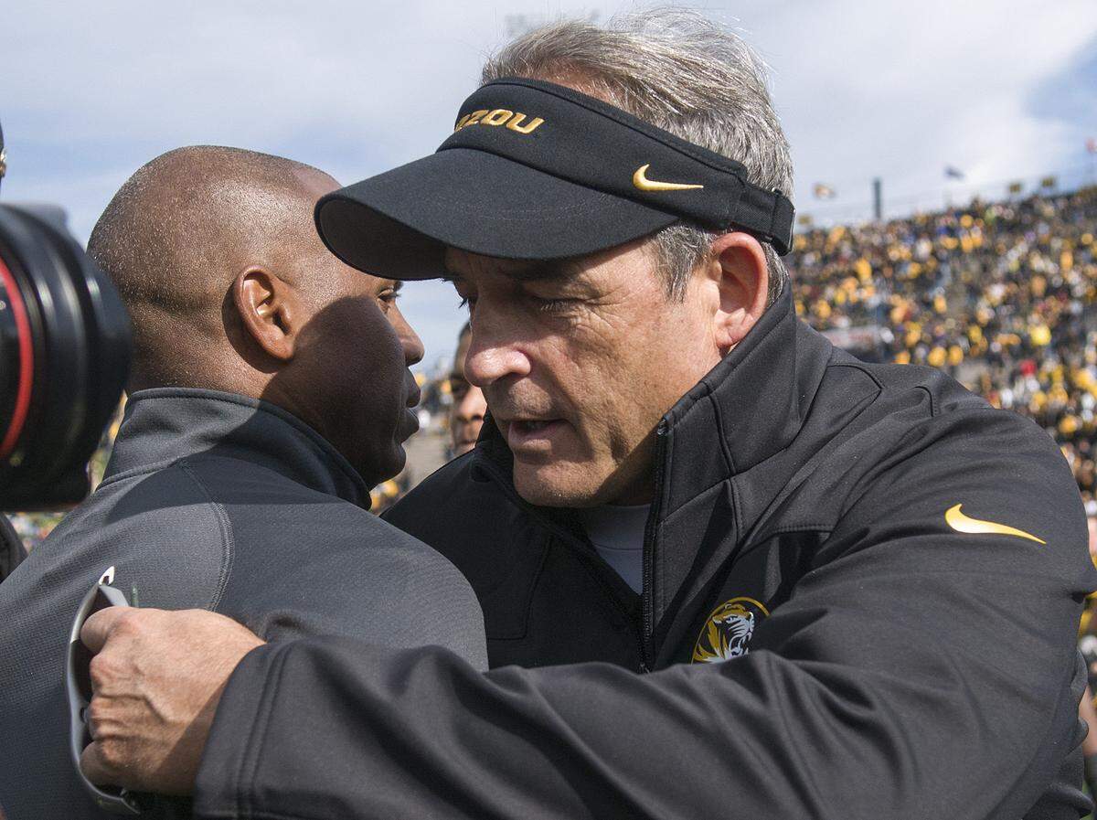 Then-Kentucky Coach Joker Phillips met with then-Missouri Coach Gary Pinkel after the Wildcats lost 33-10 at Mizzou in 2012. The loss gave the UK football program an all-time losing record (579-580-44) for the first time since the 1903 season opener.