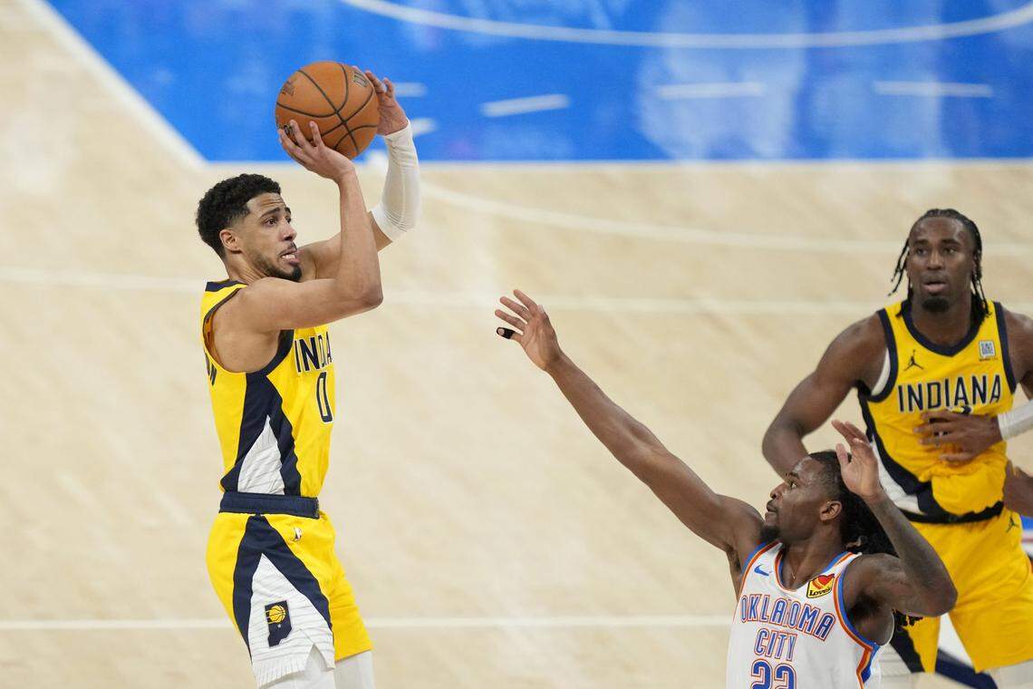 Pacers guard Tyrese Haliburton (0) shoots the ball against Thunder guard Cason Wallace (22) during the fourth quarter of Game 1 of the NBA Finals.