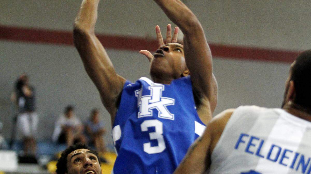UK's Tyler Ulis gets fouled by a Dominican Republic player and completes the old fashioned three point play as teh Cats fall 63-62.

The University of Kentucky men's basketball team falls to the Dominican Republic National Team 63-62 on Sunday, August 17, 2014, at the Kendal G.L. Isaacs National Gymnasium in Nassau, Bahamas.

Photo by Chet White | UK Athletics