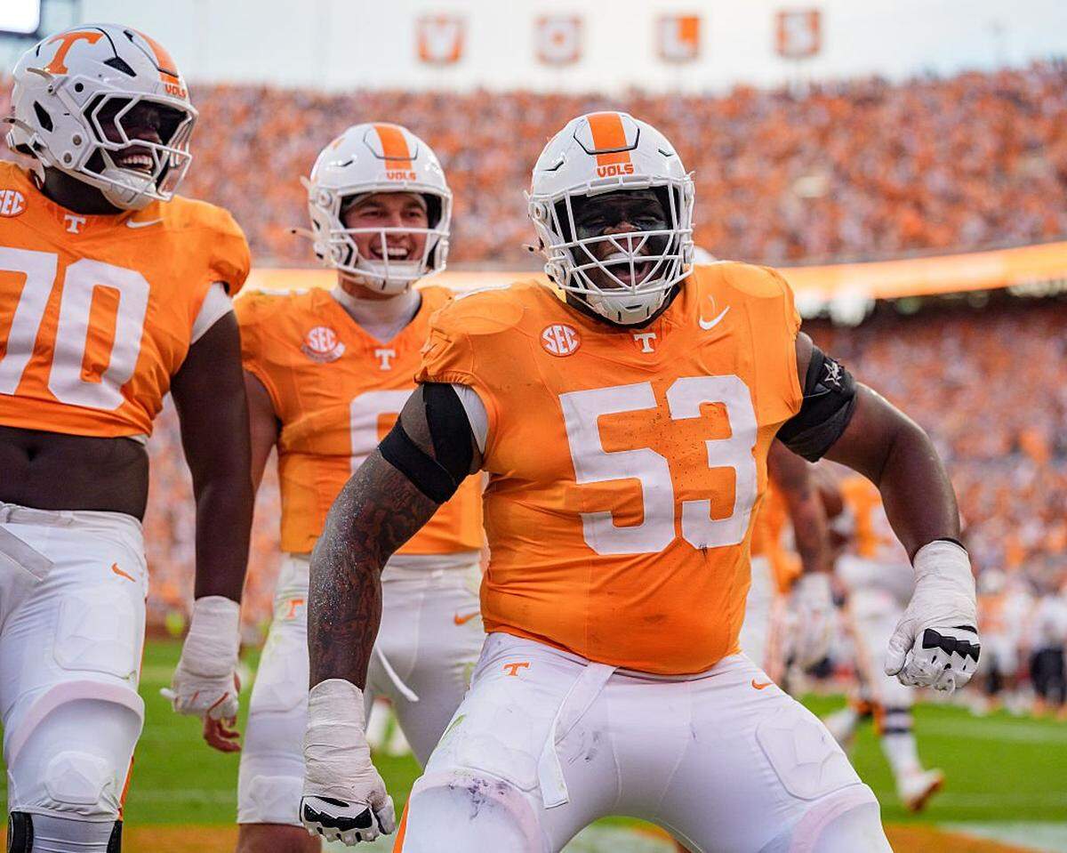 KNOXVILLE, TENNESSEE - OCTOBER 11: (L-R) David Sanders Jr. #70, Joey Aguilar #6, and Lance Heard #53 of the Tennessee Volunteers celebrate in the second half against the Arkansas Razorbacks during their game at Neyland Stadium on October 11, 2025 in Knoxville, Tennessee. (Photo by Jacob Kupferman/Getty Images)