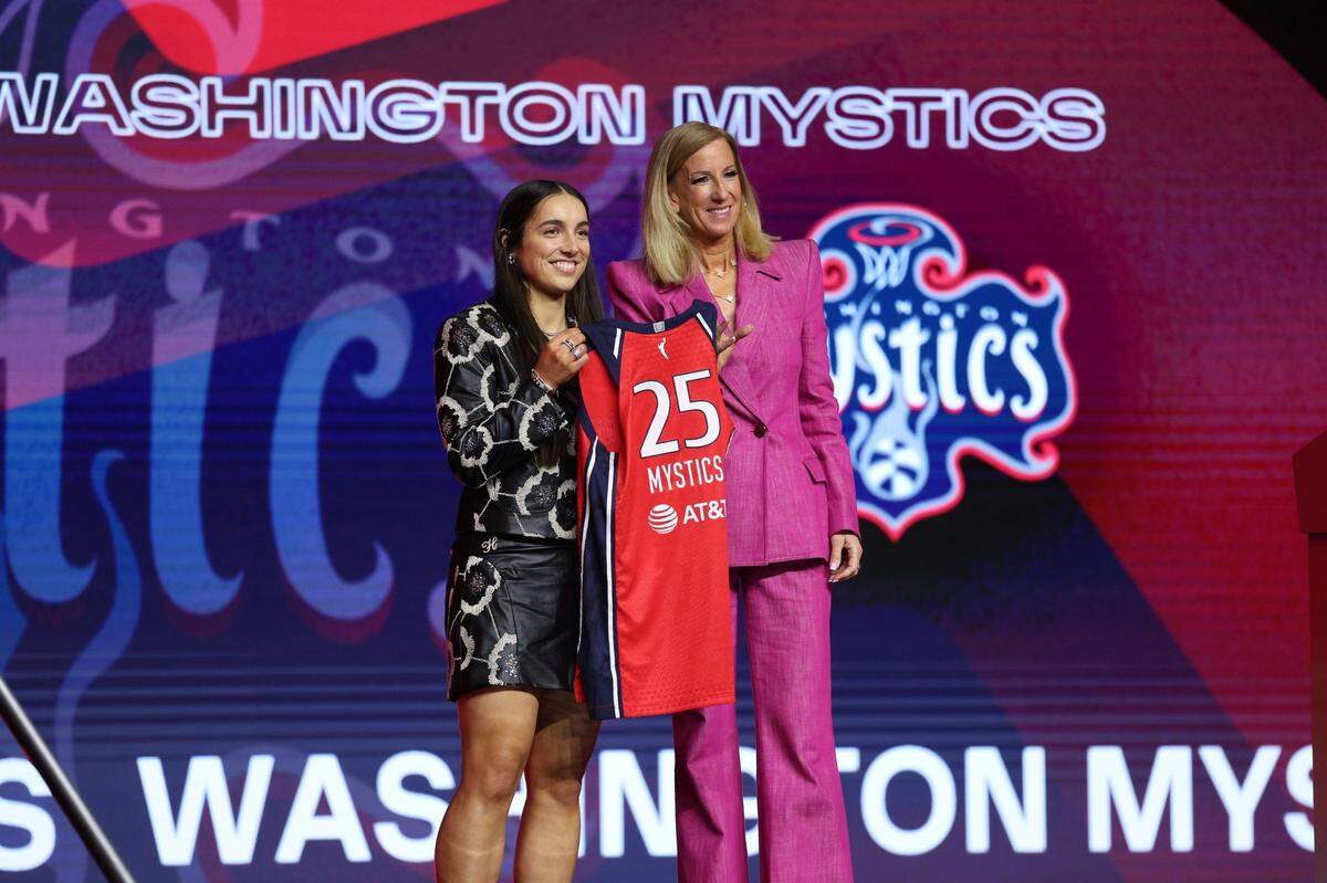 Georgia Amoore takes a photo with WNBA commissioner Cathy Engelbert after being selected with the sixth overall pick by the Washington Mystics in the 2025 WNBA draft.