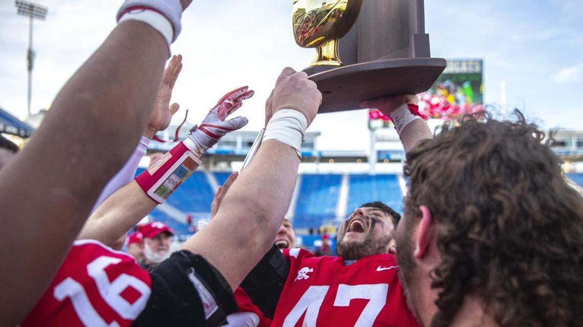 Belfry’s Zachary Savage (47) celebrates with his teammates after Belfry beat Paducah Tilghamn to claim the Class 3A state championship on Saturday.