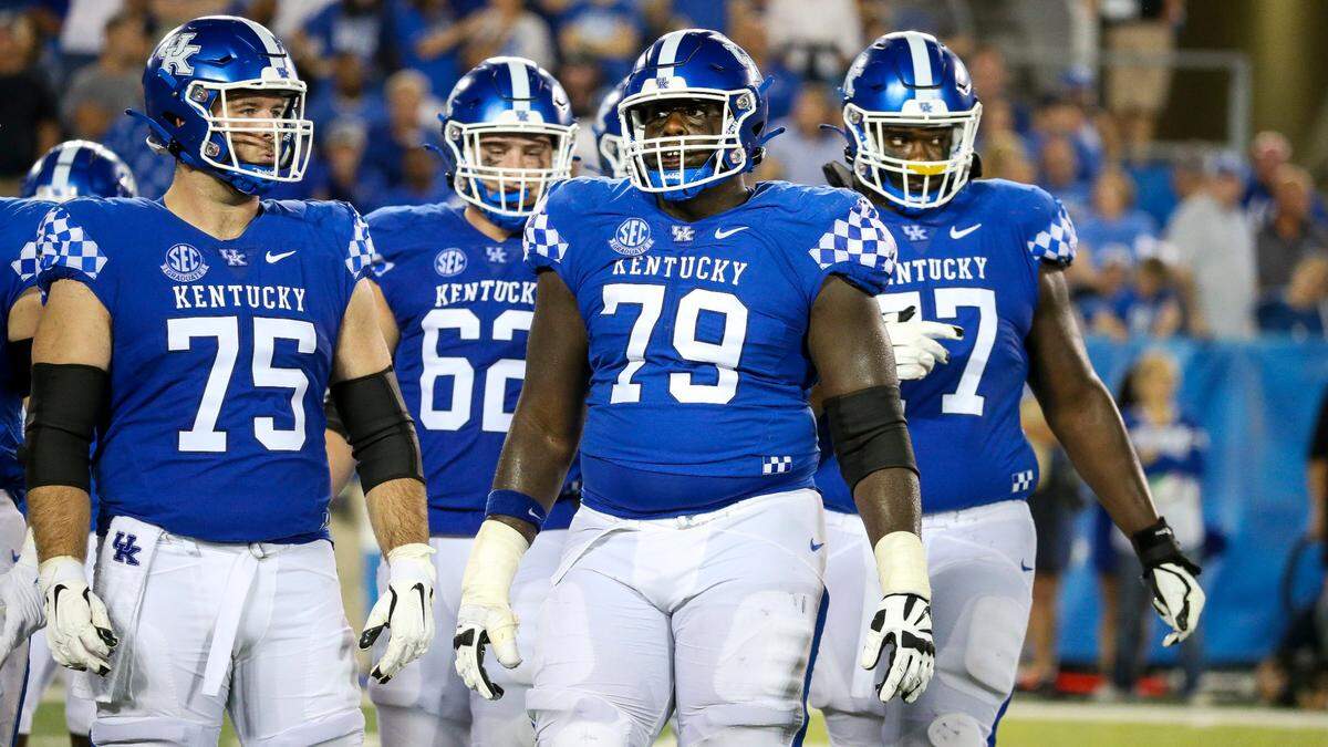 From left, Kentucky offensive linemen Eli Cox (75), Jager Burton (62), Tashawn Manning (79) and Jeremy Flax (77) during last week’s win. The battle in the trenches figures to be a key component of Saturday’s SEC opener at No. 12 Florida.