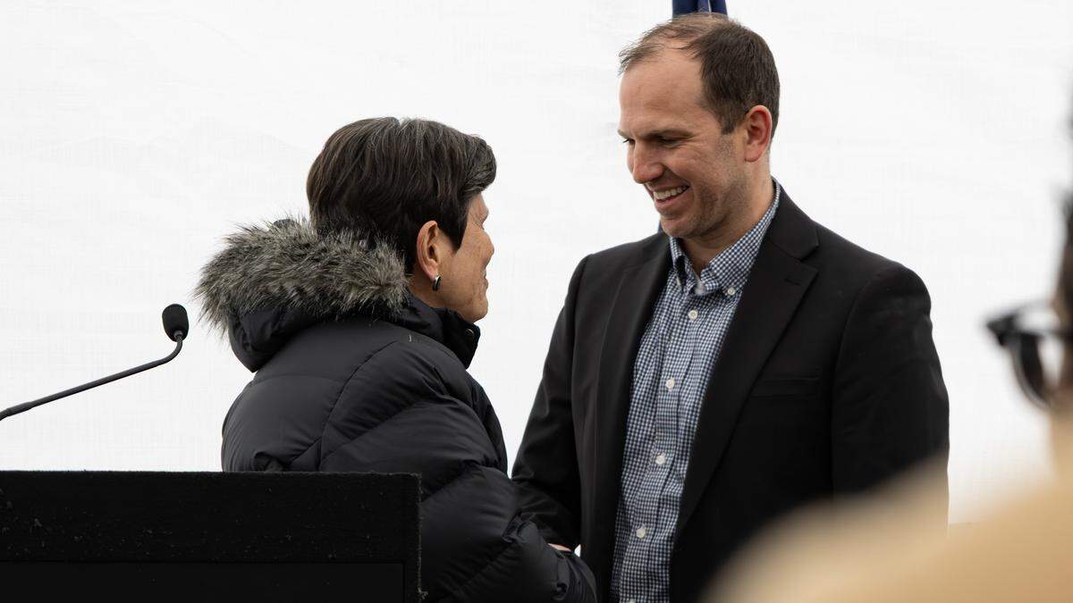 Mayor Linda Gorton shakes hands with Will Hanrahan, developer and mnaging member of 1000 Delaware LLC, before he talks about The Railyard, a mixed-income, mixed-use development that will house 32 rental homes and neighborhood retail on Delaware Avenue in Lexington, Ky., Dec. 3, 2025.