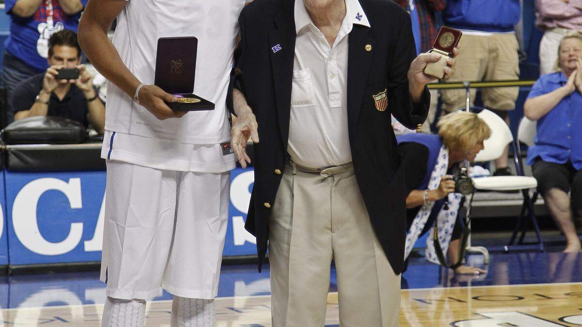 Olympic gold medalists Anthony Davis, left, and Wah Wah Jones shook hands at midcourt as  former UK players gathered for  a charity alumni game  on Saturday September 15, 2012 in Lexington, Ky. Photo by Mark Cornelison | Staff