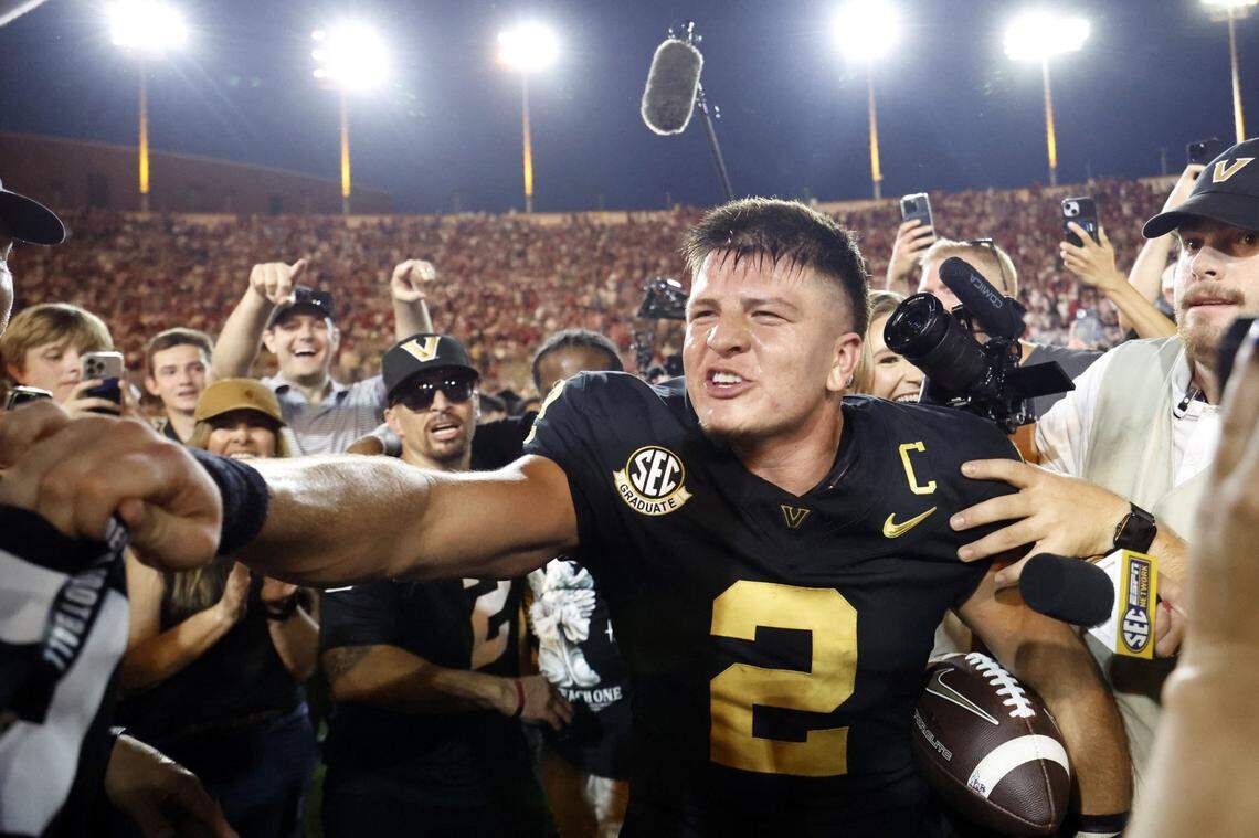 Oct 5, 2024; Nashville, Tennessee, USA;  Vanderbilt Commodores quarterback Diego Pavia celebrates with fans after defeating the Alabama Crimson Tide during the second half at FirstBank Stadium. Mandatory Credit: Butch Dill-Imagn Images