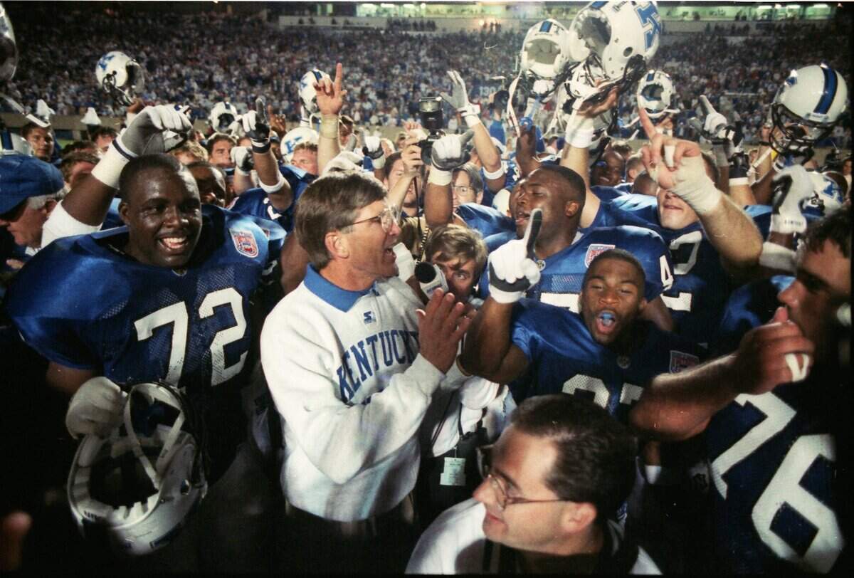 Kentucky Coach Bill Curry celebrated with his team after UK defeated 1994 season opener at Commonwealth Stadium. It was the game that launched the modern Governor’s Cup rivalry after a hiatus of 70 years.