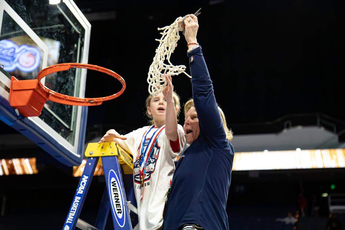 Sacred Heart Academy girls basketball coach Donna Moir celebrated after the Valkyries beat George Rogers Clark 65-60 last year to win their fifth-straight Kentucky state tournament title.