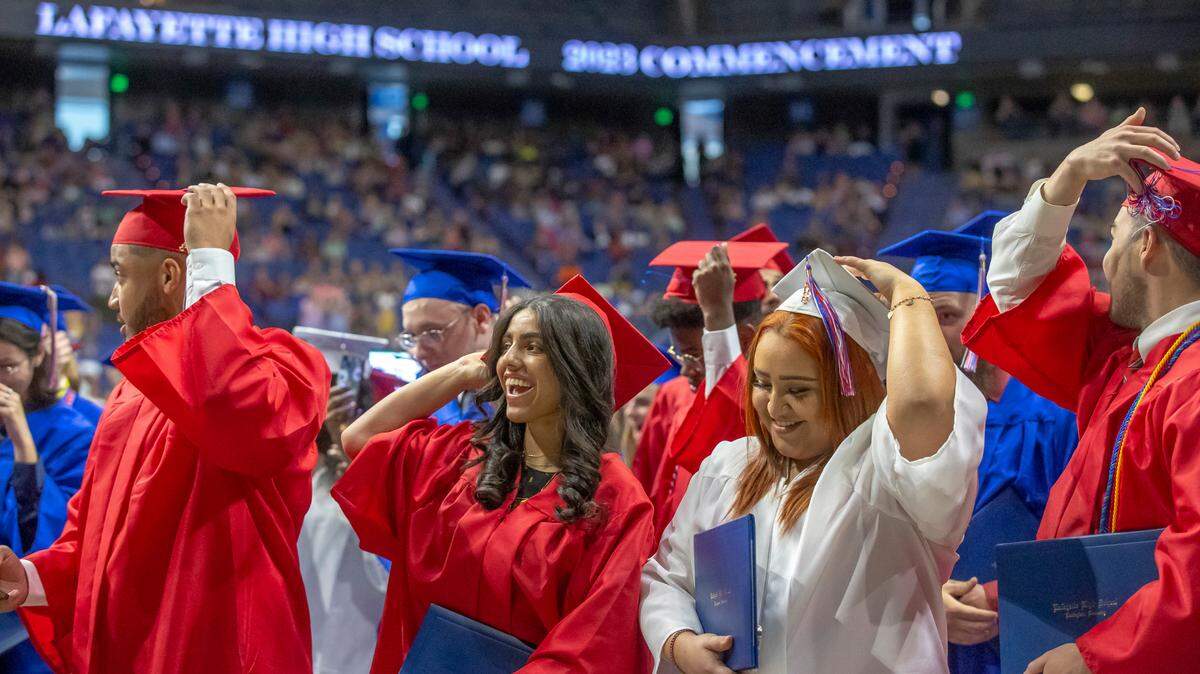 Members of the Lafayette High School Class of 2023 move the tassels on their mortarboards at the end of their commencement ceremony at Rupp Arena in Lexington, Ky., on Tuesday, May 30, 2023.