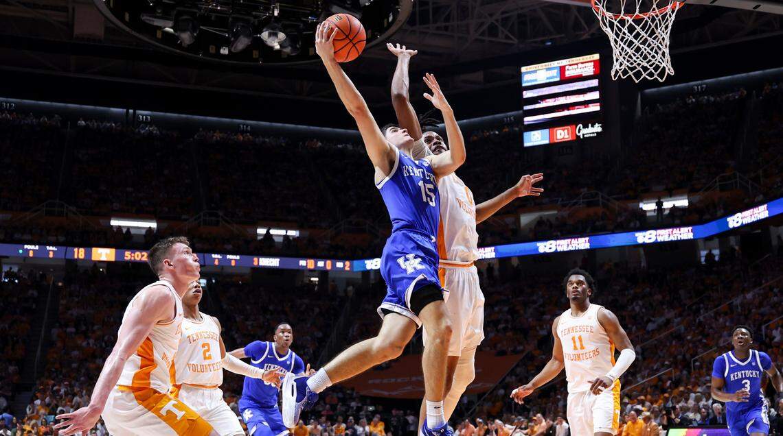 Kentucky guard Reed Sheppard (15) drives to the basket against Tennessee forward Jonas Aidoo (0) during Saturday’s game at Thompson-Boling Arena in Knoxville.