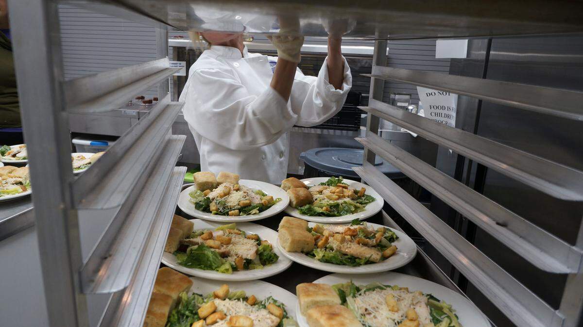 Meals that included chicken Caesar salad were plated and ready to serve to 185 luncheon guests on Thursday.