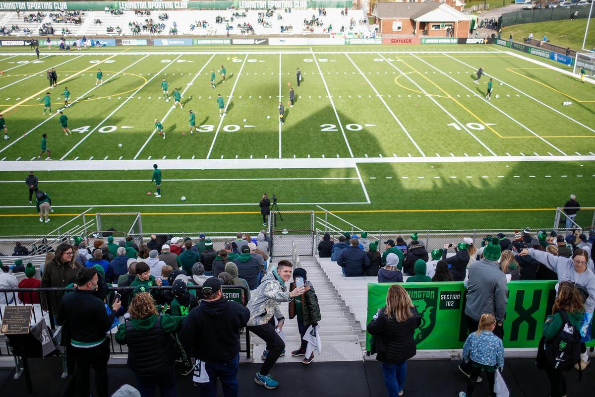 Lexington Sporting Club fans make their way around the stadium before the club’s first home match against Forward Madison FC at Toyota Stadium in Georgetown on Saturday. As part of LSC’s use of the facility, new artificial turf was recently installed at the venue.
