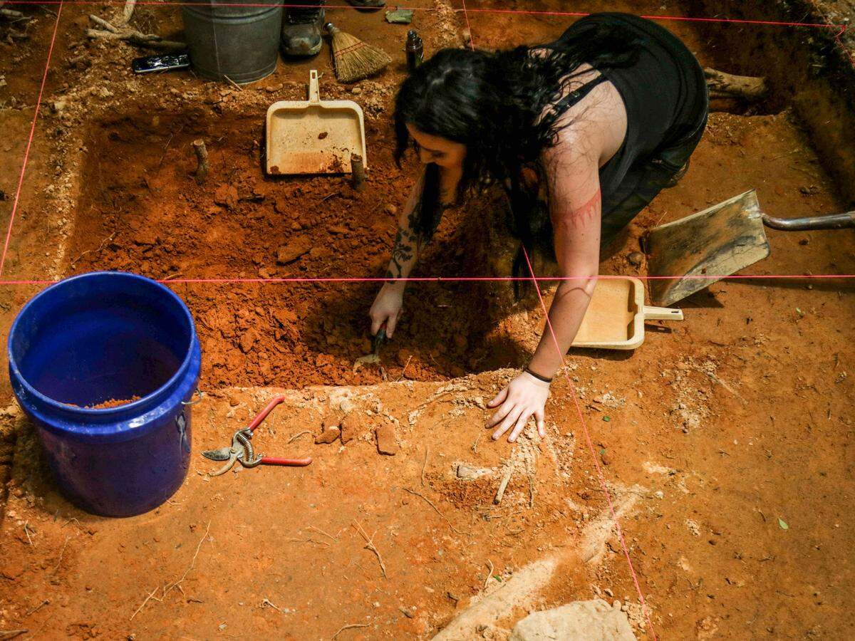 Ashley Williams, a student at Eastern Kentucky University, digs through an archeological site for a six-credit course.