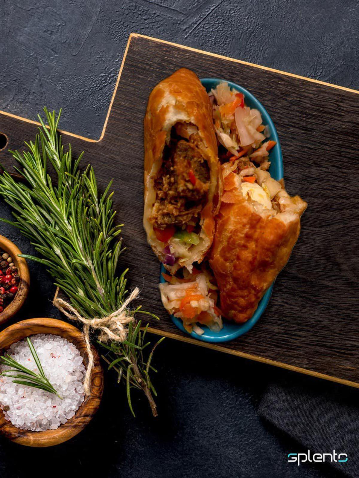 Owner and chef Patricia Gedeon says empanadas (called pâté in Haiti), like this pork one will be a popular menu item at her new restaurant, Le Gourmet. The Haitian restaurant is scheduled to open in May.