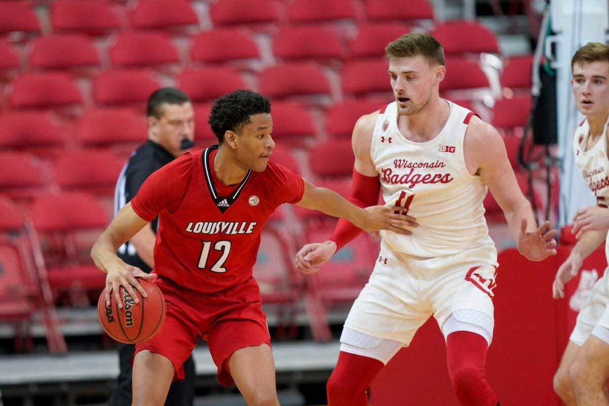 Louisville’s JJ Traynor (12) is a freshman forward and former star at Bardstown High School.