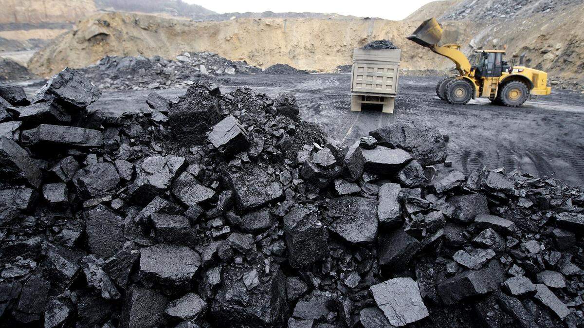 Loader and coal on a truck at a surface mine near Chavies, Ky., Friday, December  19, 2008.